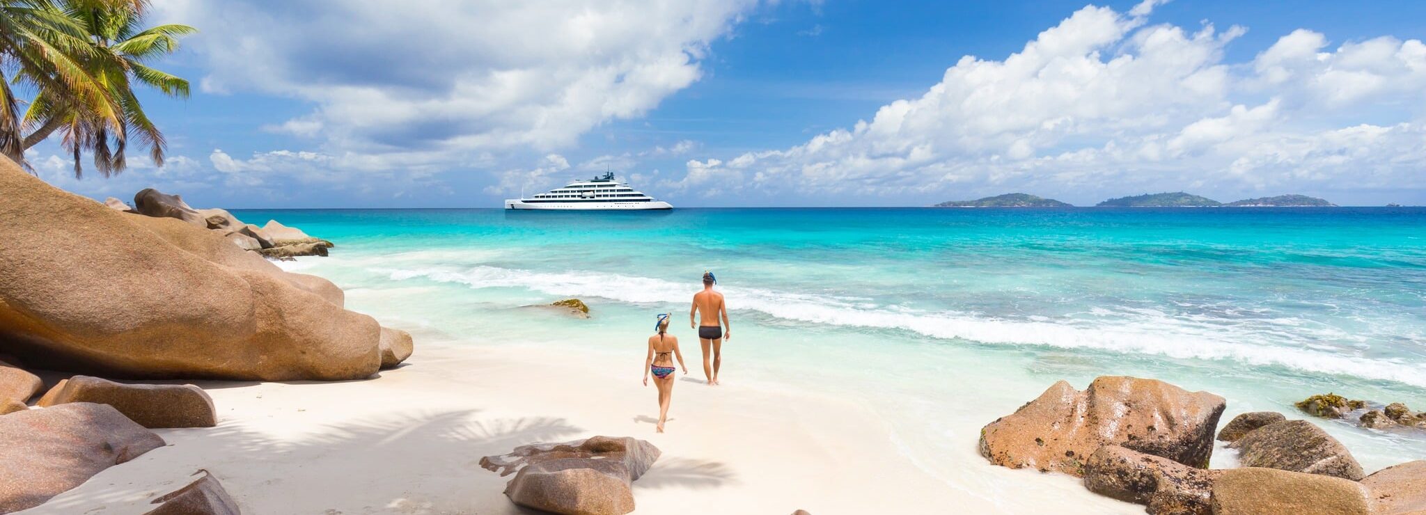 Swimming and snorkeling at Anse Patates beach on La Digue Island, Seychelles.