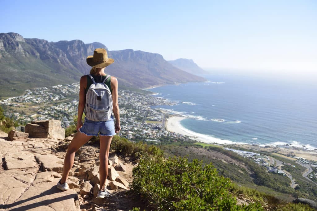 A woman exploring Cape Town in South Africa, wearing a backpack on her back to carry her personal belongings while she sightsees